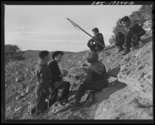 Taos County, New Mexico. Father Cassidy, the Catholic priest of the parish of Penasco, telling his troop of Boy Scouts about soil conservation and erosion