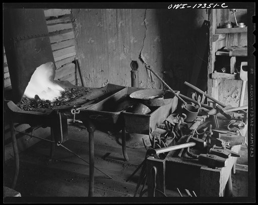 Untitled photo, possibly related to: Penasco, New Mexico. Blacksmith shop