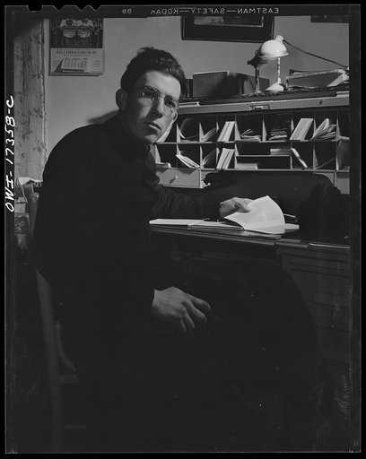 Untitled photo, possibly related to: Taos County, New Mexico. Father Cassidy, the Catholic priest of the parish of Penasco, at his desk