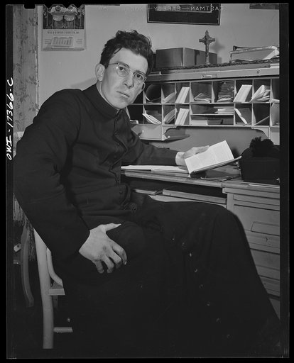 Untitled photo, possibly related to: Taos County, New Mexico. Father Cassidy, the Catholic priest of the parish of Penasco, at his desk
