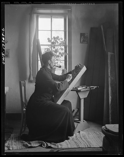 Untitled photo, possibly related to: Taos County, New Mexico. Father Cassidy, the Catholic priest of the parish of Penasco, woodcarving