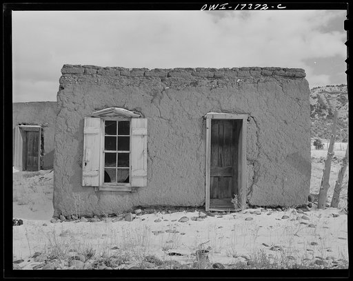 Penasco, New Mexico. Adobe houses last well when lived in, but decay quickly when vacated