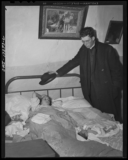 Untitled photo, possibly related to: Taos County, New Mexico. Father Cassidy, the Catholic priest of the parish of Penasco, visiting a mother and her new baby. He cooperates with the public health nurse in establishing a health education program among his parishioners