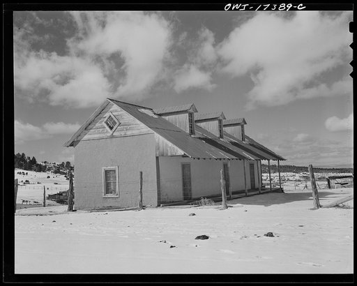 Penasco, Taos County, New Mexico. Winters are severe and many of the homes have pitched roofs to shed the long rains and snows
