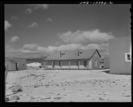 Penasco, Taos County, New Mexico. Winters are severe and many of the homes have pitched roofs to shed the long rains and snows