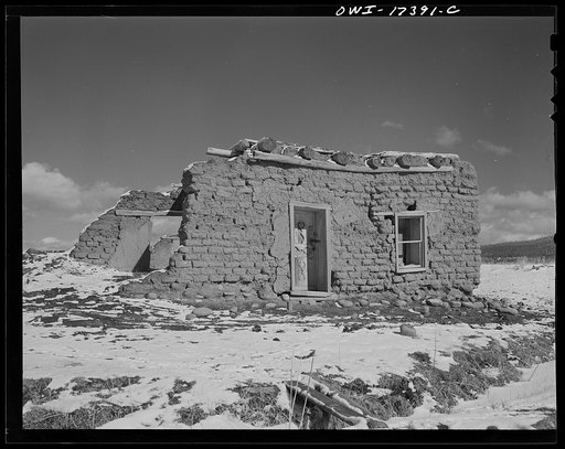 Penasco, Taos County, New Mexico. Adobe houses are nearly indestructible when lived in, but rapidly decay when abandoned