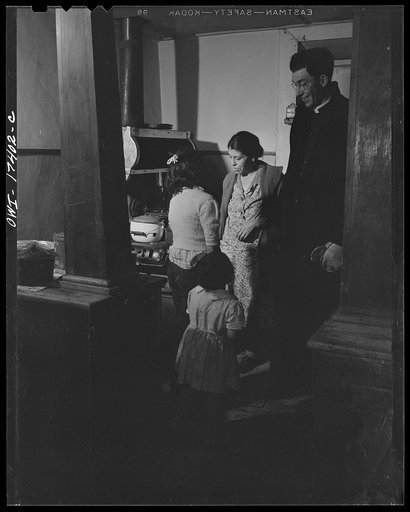 Untitled photo, possibly related to: Taos County, New Mexico. Father Cassidy, the Catholic priest of Penasco, smoking and talking things over with a parishoner