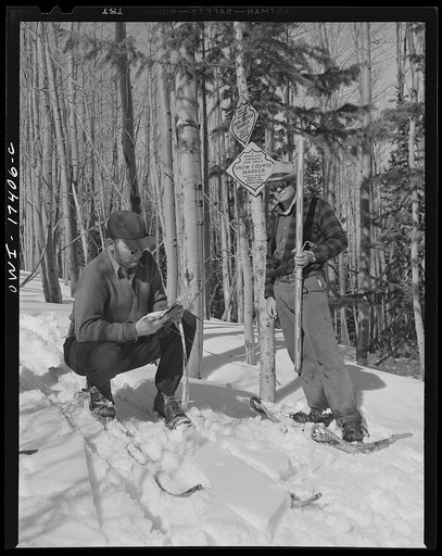 U.S. forest rangers in the Sangre de Cristo Mountains above Penasco, New Mexico, weighing snow to predict the amount of irrigation for the coming year