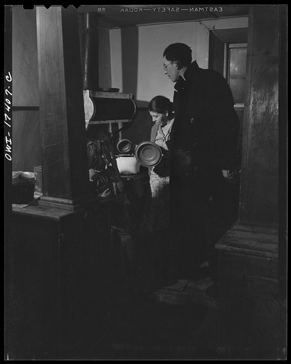 Untitled photo, possibly related to: Taos County, New Mexico. Father Cassidy, the Catholic priest of Penasco, smoking and talking things over with a parishoner