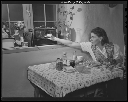Untitled photo, possibly related to: Penasco, New Mexico. Marjorie Muller, Red Cross nurse, does her own cooking in her one-room home adjoining the clinic operated by the Taos County cooperative health association