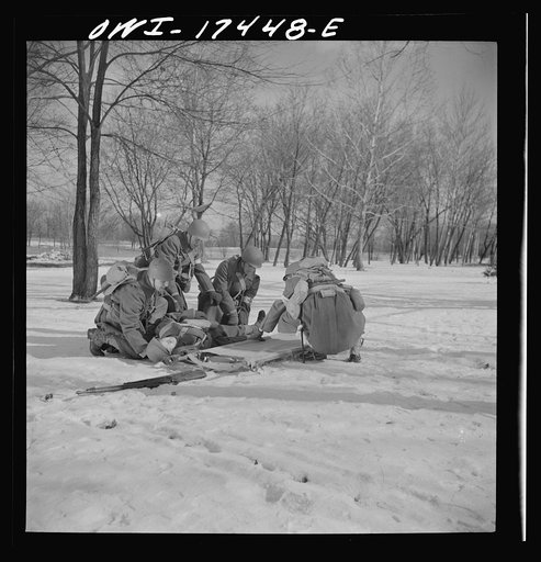 Carlisle, Pennsylvania. Demonstration before Army doctors and officer candidates at the U.S. Army medical field service school. Placing a "wounded" man on a litter