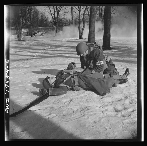 Carlisle, Pennsylvania. Demonstration before army doctors and officer candidates at the U.S. Army field service school. Three company aid men (i.e. unarmed medical soldiers), are attached to each infantry company as well as to other fighting units, and move with them into the thick of battle. When a