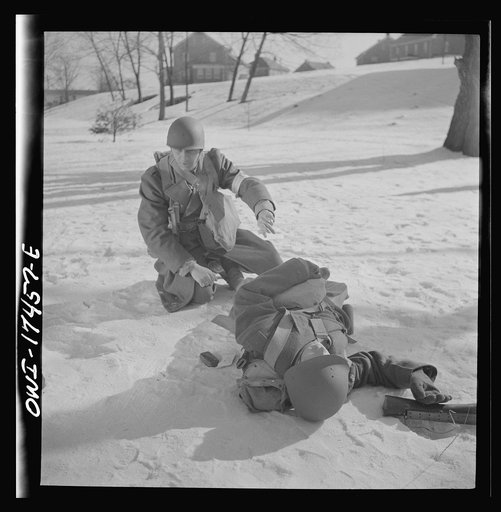 Untitled photo, possibly related to: Carlisle, Pennsylvania. Demonstration before army doctors and officer candidates at the U.S. Army field service school. Three company aid men (i.e. unarmed medical soldiers), are attached to each infantry company as well as to other fighting units, and move with 