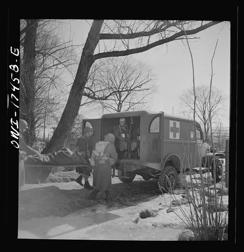 Carlisle, Pennsylvania. Demonstration before Army doctors and officer candidates at the U.S. Army medical field service school. Carrying a "wounded" man from the collecting station to the clearing station further behind the lines. The shuttle service is usually operated at night