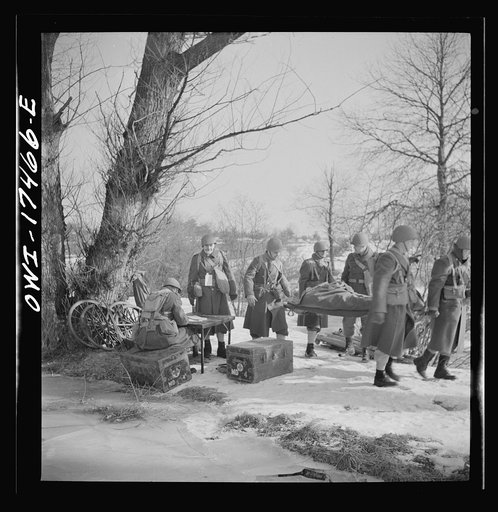 Carlisle, Pennsylvania. Demonstration before Army doctors and officer candidates at the U.S. Army medical field service school. "Wounded" soldiers who are brought into the collecting station are registered by a sergeant
