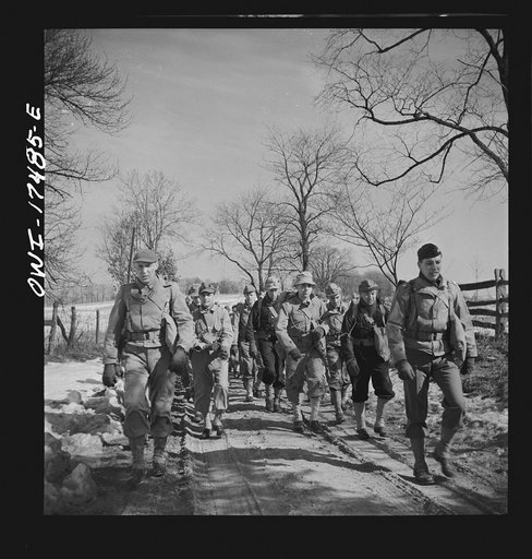 Carlisle, Pennsylvania. U.S. Army medical field service school. Officer candidates who are learning to be medical administrative officers on a road march, carrying full packs