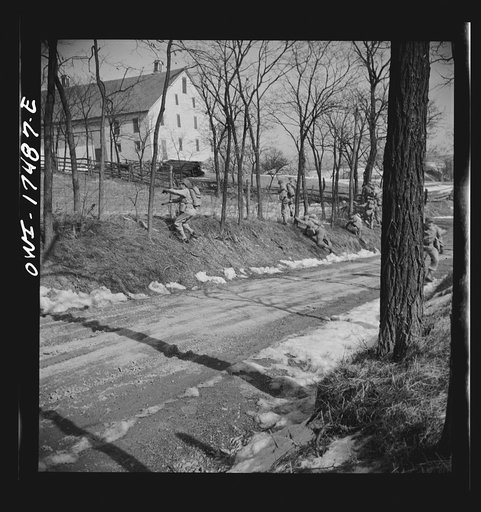 Carlisle, Pennsylvania. U.S. Army medical field service school. Officer candidates during a practice road march carrying full packs disperse singly to side of road while being "attacked" by flour bombs