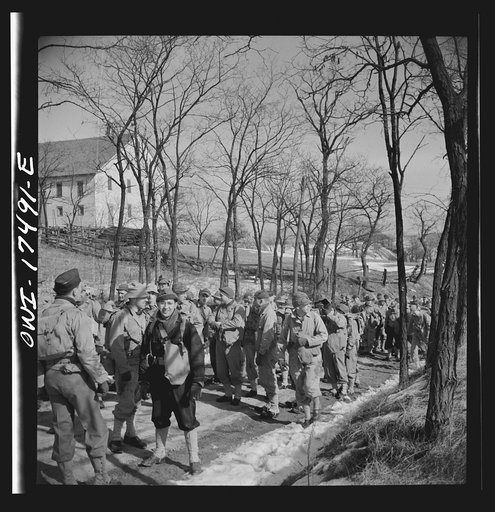 Untitled photo, possibly related to: Carlisle, Pennsylvania. U.S. Army medical field service school. Officer candidates who are learning to be medical administrative officers on a road march, carrying full packs