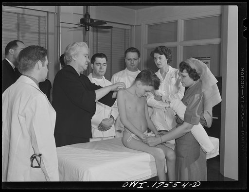 Minneapolis, Minnesota. Sister Kenny conducting a class for doctors and nurses at the Elizabeth Kenny Institute. The patient is Harry Higginbothom of Dallas, Texas