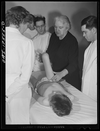 Minneapolis, Minnesota. Sister Kenny conducting a class for doctors and nurses at the Elizabeth Kenny Institute. The patient is Harry Higginbothom of Dallas, Texas