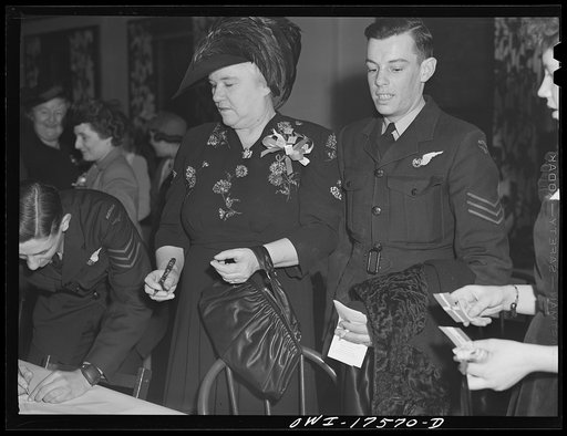 Minneapolis, Minnesota. Sister Kenny at an American Legion meeting at which she was the principal speaker. With her is Sergeant J. Rutherford of Brisbane, a member of the Australian Air Force. He was an honorary guest at the meeting