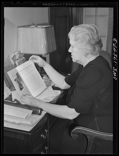 Minneapolis, Minnesota. Sister Kenny reading over one of her articles for the Physiotherapy review