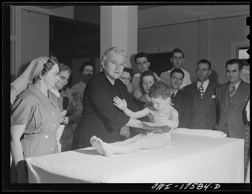 Untitled photo, possibly related to: Minneapolis, Minnesota. Marvin Goldstein, an infantile paralysis patient, showing control of abdominal muscles for the benefit of technicians and doctors