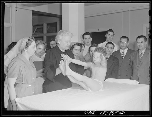Minneapolis, Minnesota. Marvin Goldstein, an infantile paralysis patient, showing control of abdominal muscles for the benefit of technicians and doctors