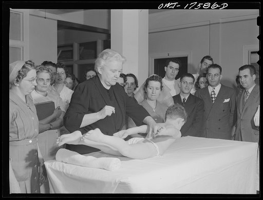 Minneapolis, Minnesota. Marvin Goldstein, an infantile paralysis patient, showing control of extensor muscles of the back at a class for technicians and doctors conducted by Sister Kenny