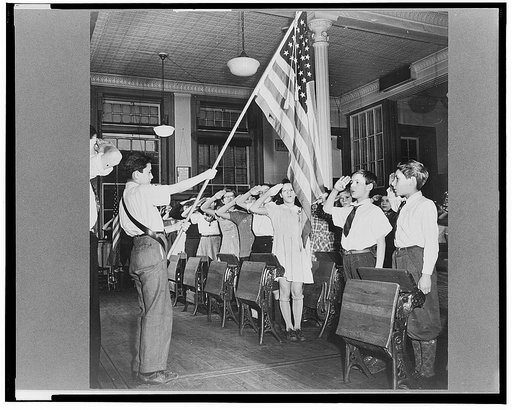 New York, New York students pledging allegiance to the flag in public school eight in an Italian-American section