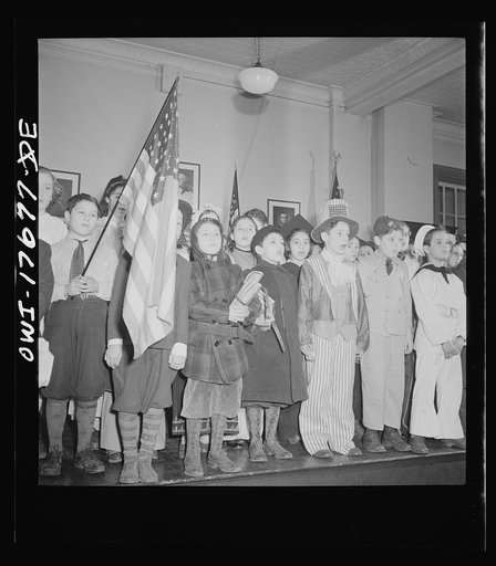 New York, New York students pledging allegiance to the flag in public school eight in an Italian-American section