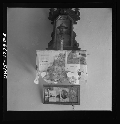Trampas, New Mexico. Photographs on the wall of Grandfather Romero's bedroom, in the house of Mayor Juan Lopez