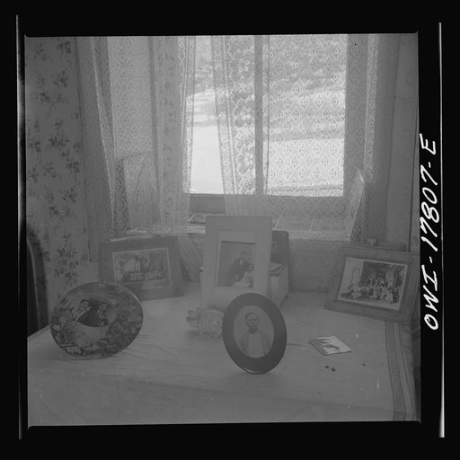 Trampas, New Mexico. Photographs of the family and friends of Juan Lopez, the majordomo (mayor) [i.e., steward]. Such pictures are among the family's prize possessions, and always on display