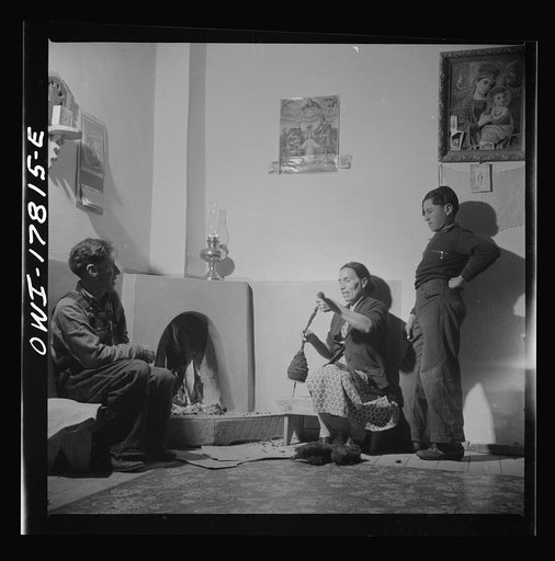Trampas, New Mexico. The temperature of Trampas drops way below zero in winter, and all social life takes place around the fire. An evening scene in the home of Juan Lopez, the majordomo (mayor) [i.e., steward