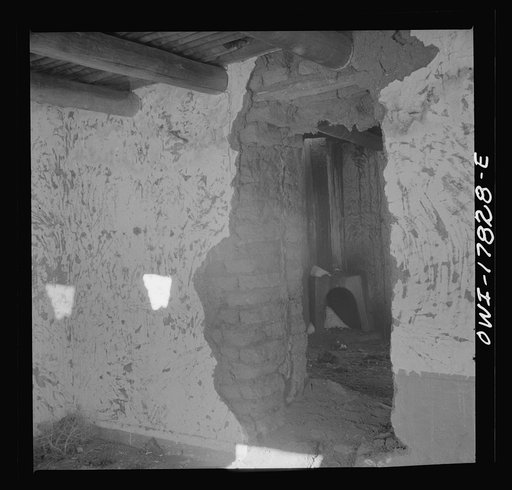 Trampas, Taos County, New Mexico. A deserted adobe in a Spanish-American village in the foothills of the Sangre de Cristo Mountains. Many generations lived in this house but lack of a cash crop caused the family to move away
