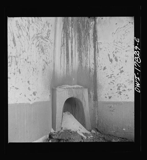 Trampas, Taos County, New Mexico. A deserted adobe in a Spanish-American village in the foothills of the Sangre de Cristo Mountains. This fireplace was used for cooking and heating