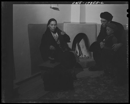 Taos County, New Mexico. Father Cassidy, the Catholic priest of the parish of Penasco, advising Mr. Lopez, a parishioner