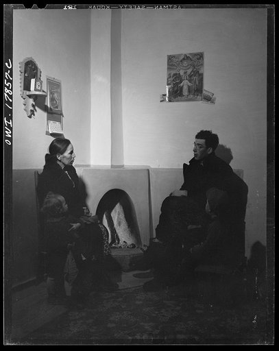 Untitled photo, possibly related to: Taos County, New Mexico. Father Cassidy, the Catholic priest of the parish of Penasco, advising Mr. Lopez, a parishioner