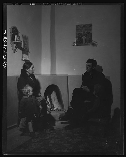 Taos County, New Mexico. Father Cassidy, the Catholic priest of the parish of Penasco, advising Mr. Lopez, a parishioner