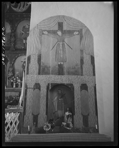 Trampas, New Mexico. The side altar to the right of the nave of a church which was built in 1700, and is the best-preserved colonial mission in the Southwest