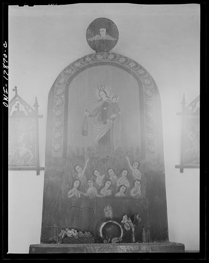 Trampas, New Mexico. Altarpiece to the right facing the main altar of a church which was built in 1700, and is the best-preserved colonial mission in the Southwest