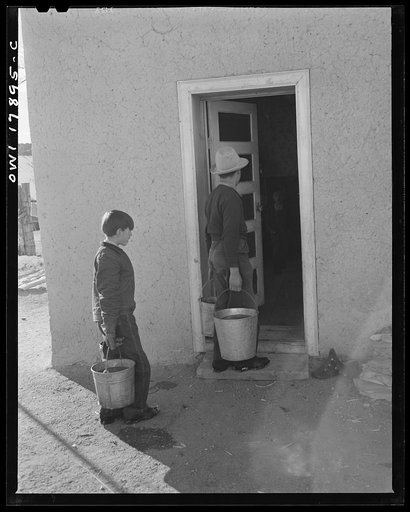 Trampas, New Mexico. Water for use in the household of Juan Lopez, the majordomo (mayor) [i.e., steward], is carried from the river, a quarter of a mile away