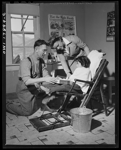 Questa, New Mexico. Dentist making an extraction in the clinic operated by the Taos County cooperative health association