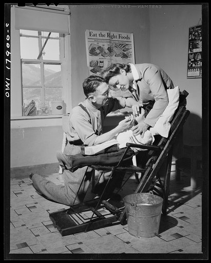 Untitled photo, possibly related to: Questa, New Mexico. Dentist making an extraction in the clinic operated by the Taos county cooperative health association