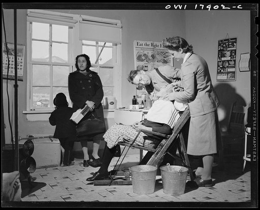 Questa, New Mexico. Dentist making an extraction in the clinic operated by the Taos County cooperative health association