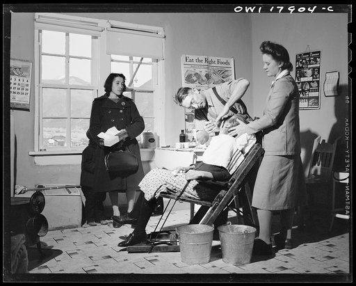 Untitled photo, possibly related to: Questa, New Mexico. Dentist making an extraction in the clinic operated by the Taos County cooperative health association