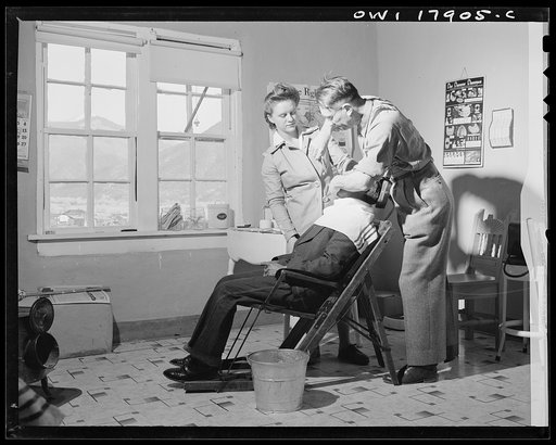 Questa, New Mexico. Dentist making an extraction in the clinic operated by the Taos County cooperative health association