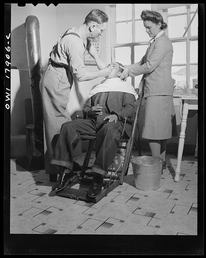 Untitled photo, possibly related to: Questa, New Mexico. Dentist making an extraction in the clinic operated by the Taos County cooperative health association
