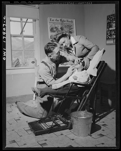 Questa, New Mexico. Dentist making an extraction in the clinic operated by the Taos County cooperative health association