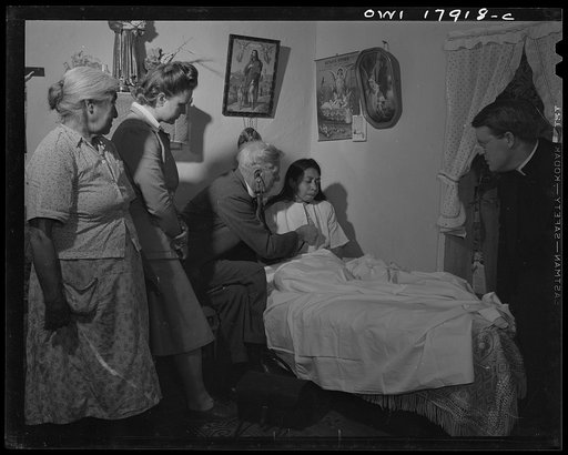 Questa, New Mexico. Doctor Onstine, of the clinic operated by the Taos County cooperative health association, and Father Smith, the parish priest, at the bedside of a tuberculosis patient